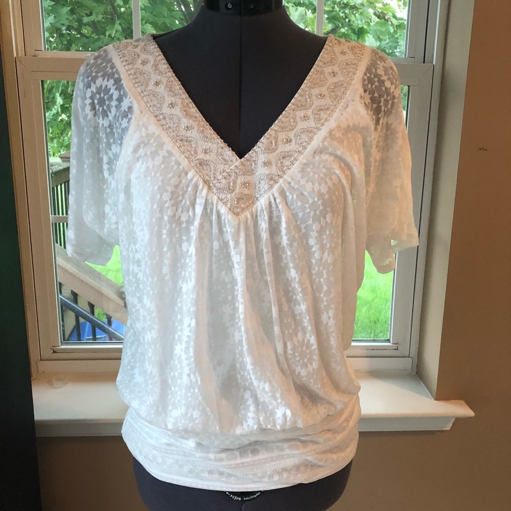 Ivory embellished burn-out tee.